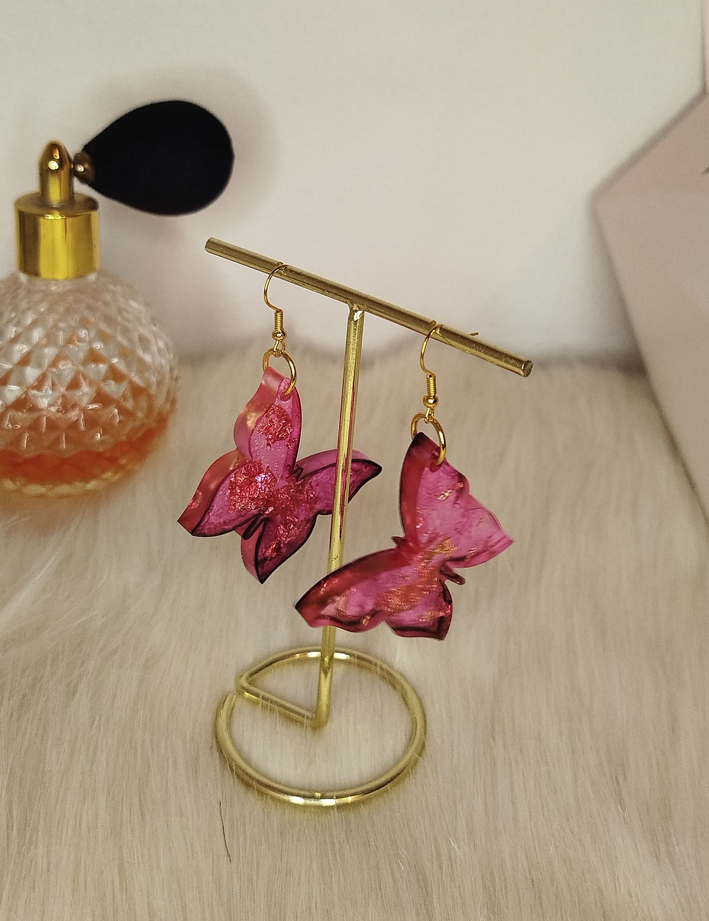 Boucle d'oreille papillon rose