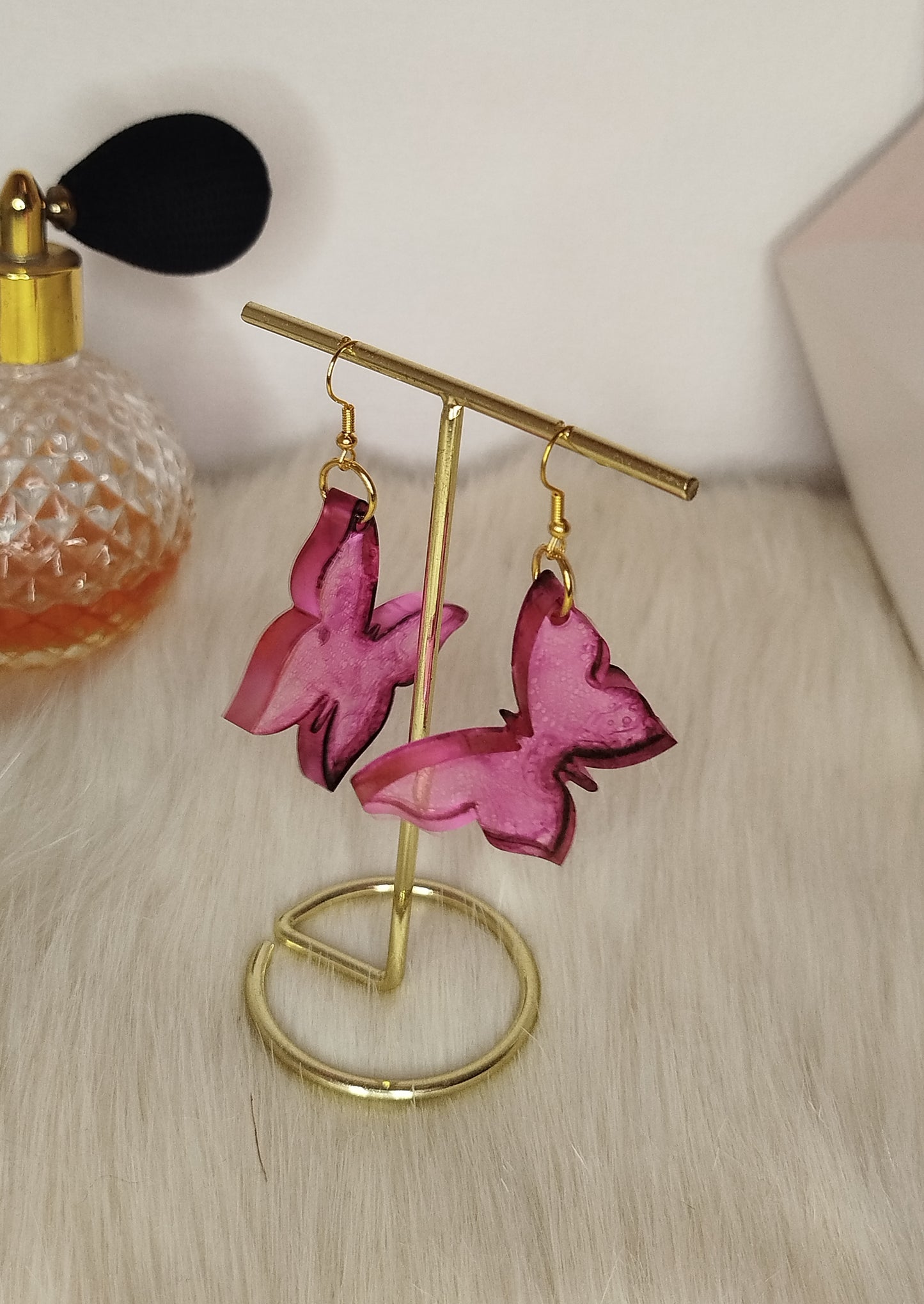 Boucle d'oreille papillon rose